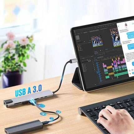 8-in-1 USB-C Multiport Hub for Laptops and Peripherals connected to tablet, external monitor, keyboard and storage for a compact workspace