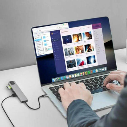 8-in-1 USB-C Multiport Hub for Laptops and Peripherals connected to laptop with external monitor, keyboard, mouse and SD card for travel and remote work