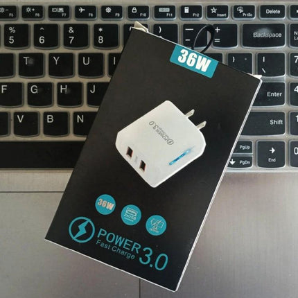 USB Charger for Everyday Device Charging at Home and Travel — 36W dual QC3.0 fast charger on laptop background