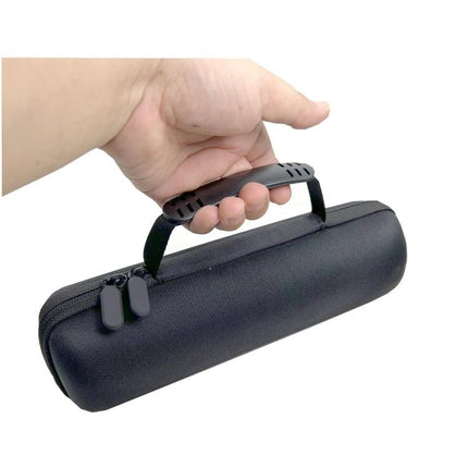 Compact Water Resistant Travel Case For Portable Bluetooth Speakers held by hand, zippered EVA shell with handle, shockproof interior