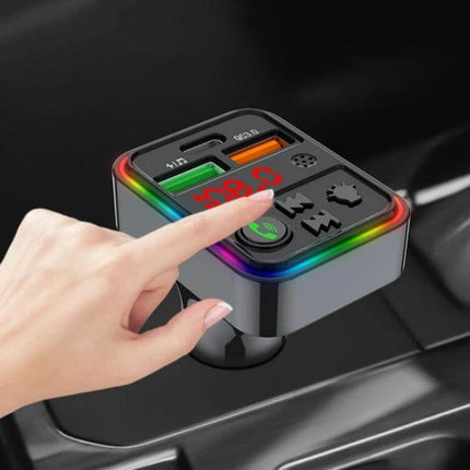 Compact in-car device showing ports and controls: Car Phone Charger With Bluetooth FM Transmitter For Smartphones used in a cup holder, dual USB and RGB ring