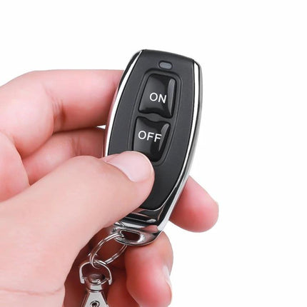 Hand holding Industrial Wireless Remote Controller for Lifter Operation with ON and OFF buttons for remote lifter control