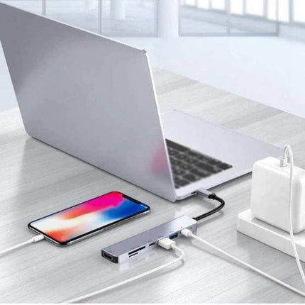 USB C Multiport Hub for Expanding Laptop Connections with HDMI connected to laptop showing HDMI, PD charging, and SD card access for dual-screen productivity