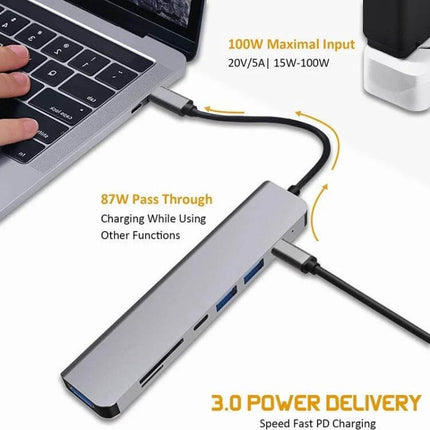 USB C Multiport Hub for Expanding Laptop Connections with HDMI — slim aluminum hub with HDMI, PD pass-through, SD slot and USB ports connected to laptop