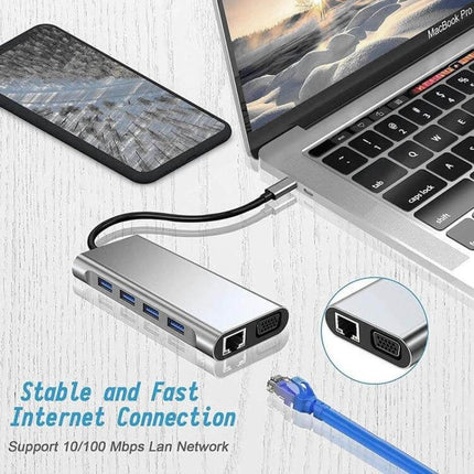 USB C Hub for Connecting Devices to Laptops and Computers - 11-in-1 aluminum hub with Ethernet, VGA and multiple USB ports next to laptop