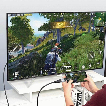 USB-C to HDMI Adapter for Connecting Devices to External Displays showing mobile game mirrored to TV for streaming and multitasking