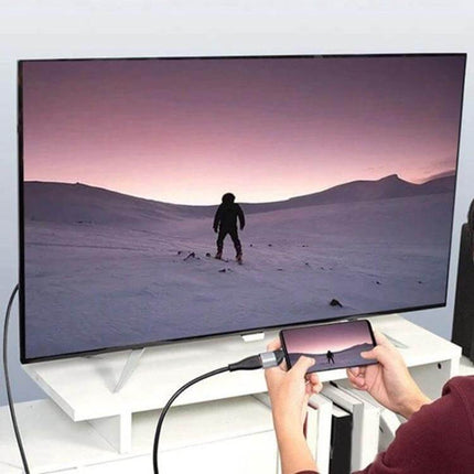 USB-C to HDMI Adapter for Connecting Devices to External Displays showing phone mirrored on large TV for presentations or streaming