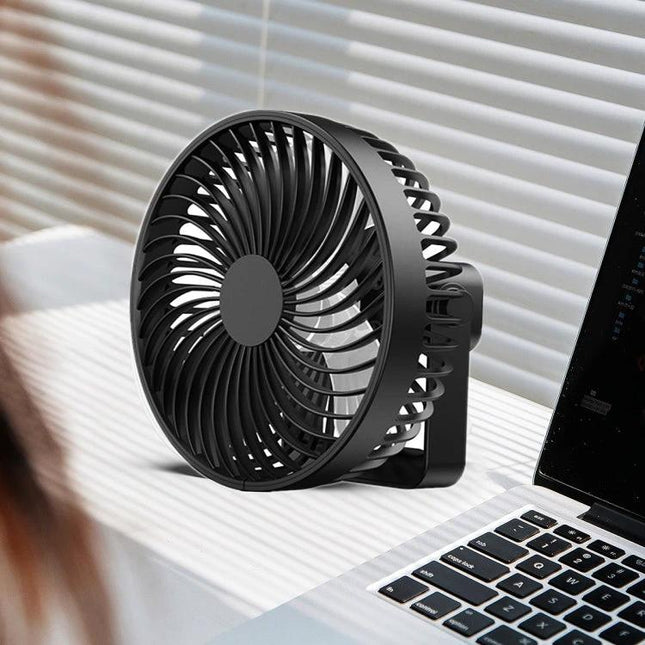 Rechargeable Portable Tent Fan with LED Light for Camping on desk near laptop providing compact cooling and adjustable airflow