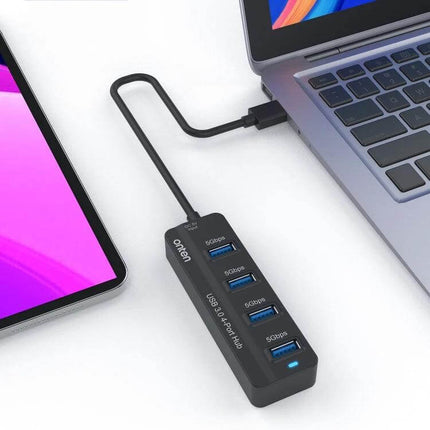 Onten 4-Port USB 3.0 Hub for Device Connections and Charging connected to laptop and tablet with four USB 3.0 ports for data transfer and charging