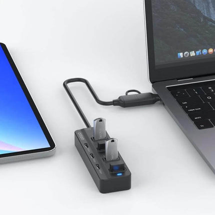 Onten 7-Port USB Hub for Connecting Multiple Devices Daily - compact hub with USB-C and USB-A ports attached to laptop charging and data transfer