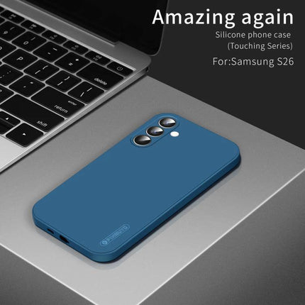 PINWUYO Silicone Case for Everyday Samsung Phone Protection in blue TPU on table next to laptop, shows camera cutouts and slim profile