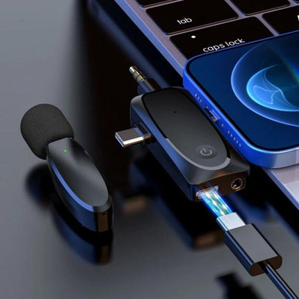 One by Two Lavalier Microphone for Everyday Audio Capture shown connected to a smartphone and laptop for on-the-go vlogging and interviews