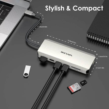 Wavlink USB-C Docking Station for Triple Monitor Setup connected to laptop with multiple ports, SD card and USB devices, compact silver hub