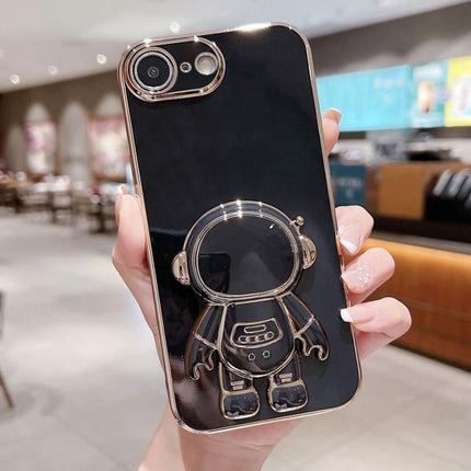 Phone Case With Integrated Stand For Hands Free Viewing showing glossy black case with metallic astronaut stand holder for video calls and watching
