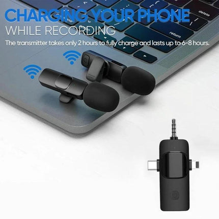 Clip-On Microphones for Everyday Video Calls and Recordings: two compact clip-on mics charging on a laptop keyboard, ideal for mobile meetings and interviews
