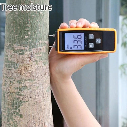 Digital Wood Moisture Meter for Building Material Testing measuring tree moisture showing 33.6% on digital display