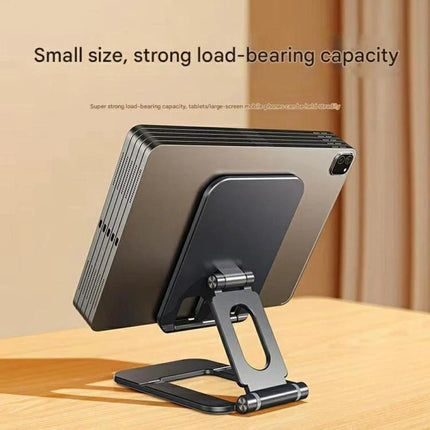 Foldable Adjustable Aluminum Holder for Phones and Tablets showing a tablet on a compact, adjustable aluminum stand for hands-free viewing