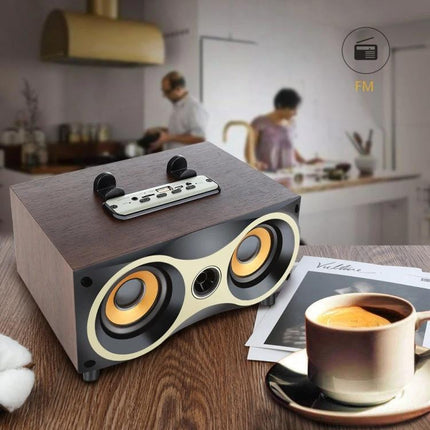 Compact Wooden Bluetooth Speaker For Home And Kitchen Use on countertop with coffee cup and blurred kitchen background