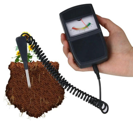 Digital Soil Moisture and pH Meter for Gardening Plant Care handheld probe inserted in soil showing moisture and pH gauge