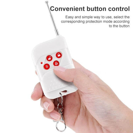 Wireless Keychain Remote for Home Security Alarm Systems - white four-button key fob with retractable antenna held in hand
