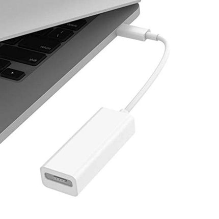 USB C to Mag-Safe Charging Adapter for MacBooks and Phones connected to a MacBook Pro for secure magnetic charging and easy disconnect