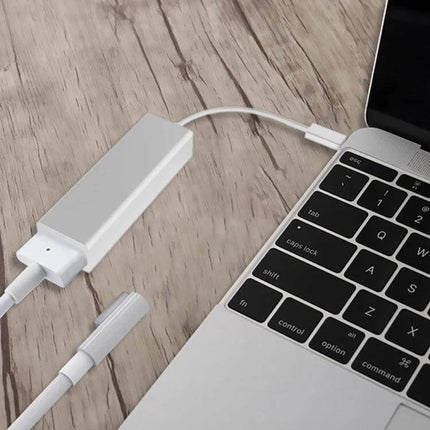 USB C to Mag-Safe Charging Adapter for MacBooks and Phones attached to MacBook keyboard showing magnetic connector and USB-C cable