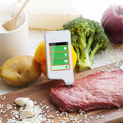 Handheld Nitrate Residue Tester for Fresh Produce and Meat detecting nitrates in meat and vegetables on a kitchen cutting board