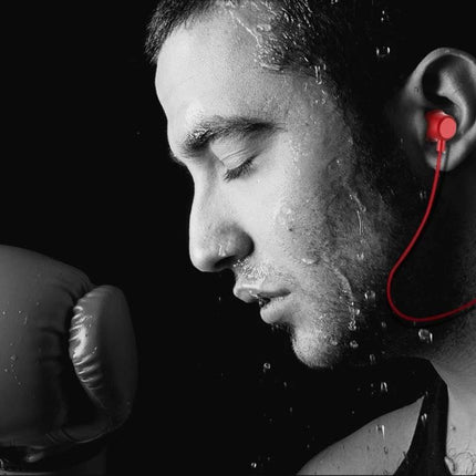 Sport Bluetooth Headset For Running And Daily Commute in-ear sweat-resistant red earbuds shown on a focused male runner