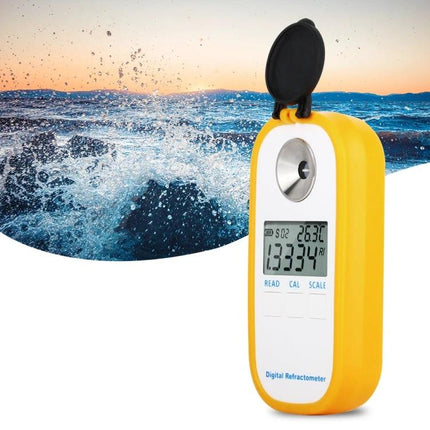 Digital Refractometer for Seawater Salinity Measurement yellow handheld device showing LCD reading against ocean background