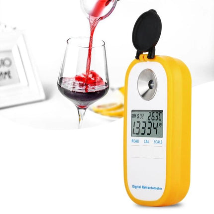 Digital Refractometer for Measuring Sugar in Wine and Beer showing digital reading beside a glass of red wine during testing