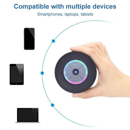 Compact Waterproof Shower And Beach Speaker With Suction Cup shown held in hand with LED ring and device compatibility icons