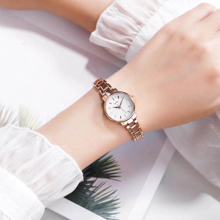 Skmei Steel Belt Quartz Watch for Women in Business Style on wrist, rose gold steel belt, minimal white dial, professional everyday accessory