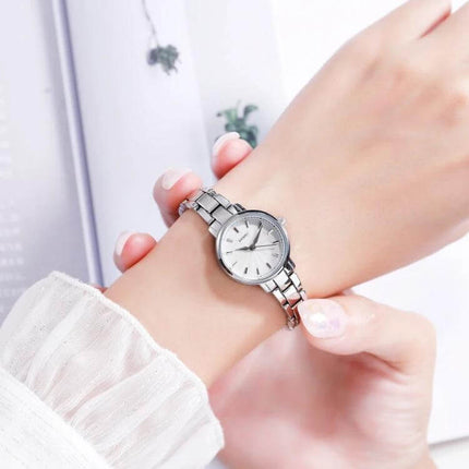 Skmei Steel Belt Quartz Watch for Women in Business Style - silver stainless steel bracelet wristwatch on female wrist, minimalist business design