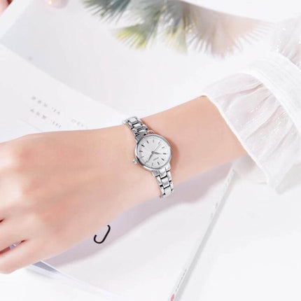 Skmei Steel Belt Quartz Watch for Women in Business Style on a woman’s wrist, slim silver business-style quartz timepiece