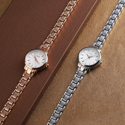 Skmei Steel Belt Quartz Watch for Women in Business Style - rose gold and silver slim stainless steel wristwatches on textured background