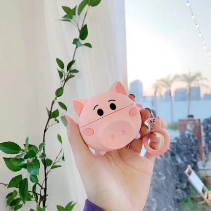 Cute Pig-Shaped Case for Everyday AirPods Protection held in hand, pink dustproof pig design with reserved charging port and keyring