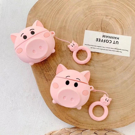Cute Pig-Shaped Case for Everyday AirPods Protection showing two pink pig silicone AirPods cases with dustproof finish and attached pig ring holders