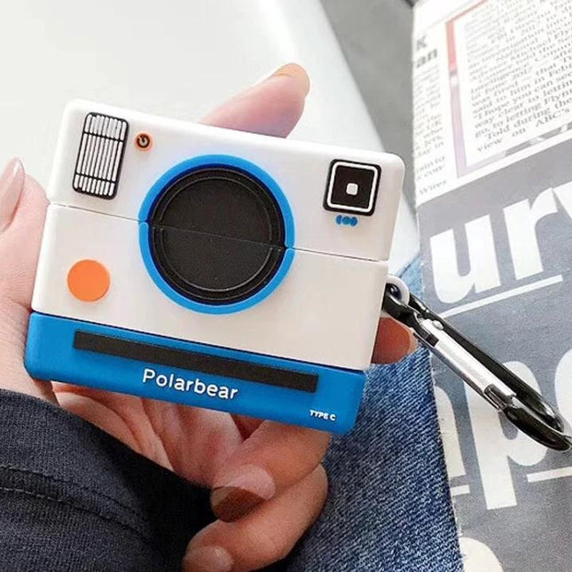Camera-Style Case for Everyday AirPods Protection – compact dustproof camera-shaped case with charging port and keyring, white and blue