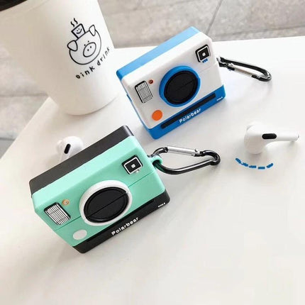 Camera-Style Case for Everyday AirPods Protection mint and blue camera-shaped cases with carabiner, dustproof exterior and built-in charging port