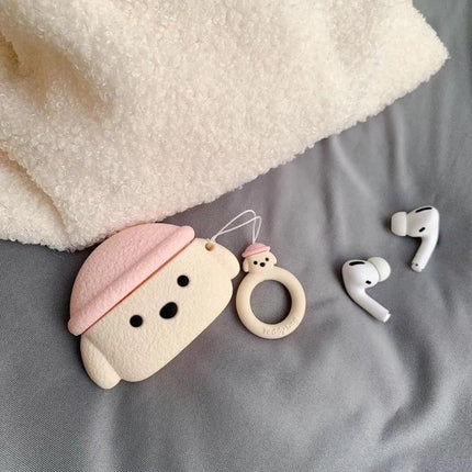 Cute Teddy Dog Protective Case for AirPods Pro Daily Use - beige pink teddy dog case with ring accessory and AirPods Pro on gray fabric