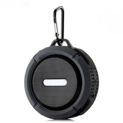 Compact Bluetooth Car Speaker With Clip For Commuting shown clipped to carabiner, portable waterproof design, wireless playback