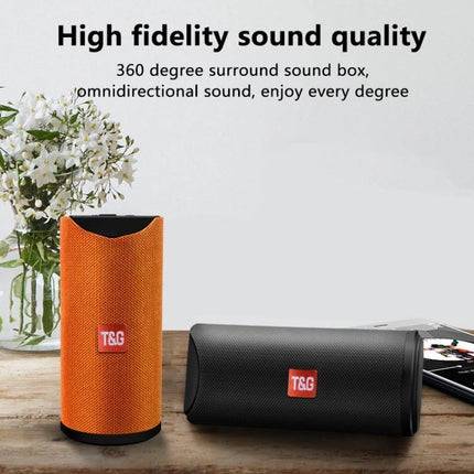 Portable Bluetooth Travel Speaker With FM Radio For Outdoor shown orange and black speakers on table with high fidelity sound text