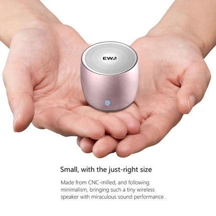 EWA Compact Bluetooth Speaker For Jogging And Travel shown in hands, rose gold portable speaker for jogging travel and calls