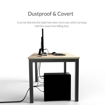 Orico Desktop Multi-Function Hub with USB and Audio Ports showing a desktop setup with computer, cables routed through table and hub tucked under desk