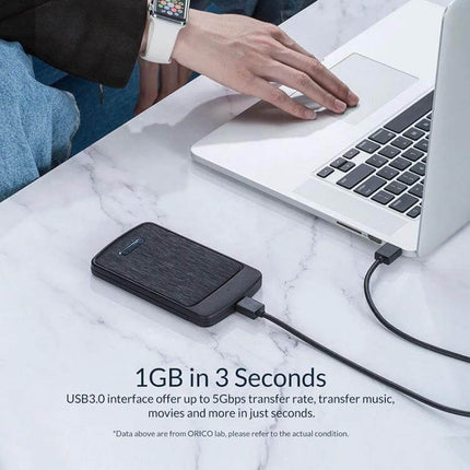 Orico 2.5-Inch Hard Drive Enclosure for Portable Storage connected to laptop via USB 3.0 for fast external storage and backups