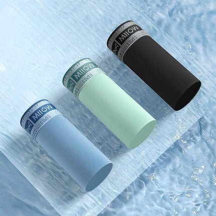 Seamless Ice Silk Men's Boxer Briefs For Everyday Comfort - three ice-silk boxer briefs in black, mint, and blue on textured icy background