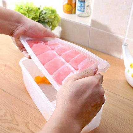Small Square Ice Mold Trays Five-Layer With Cover Storage Box showing hands lifting covered tray of pink ice cubes into clear storage box