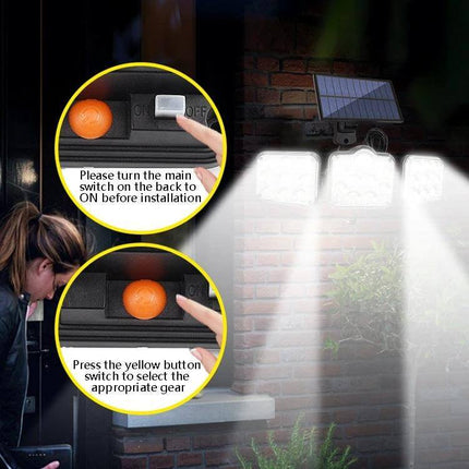 Solar 3-Head Rotatable Outdoor Wall Light For Garden with solar panel, three adjustable LED heads and motion sensor illuminating a brick walkway