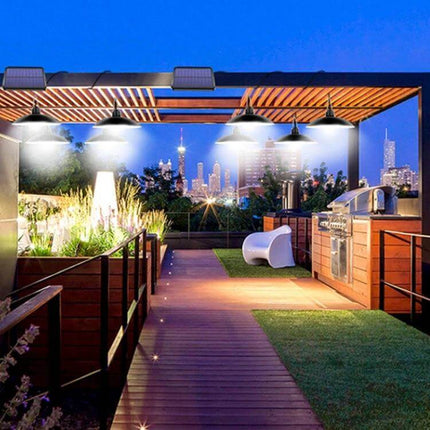 Solar Outdoor Landscape Light For Courtyard And Pathways Warm Light illuminating a wooden pathway and garden seating area