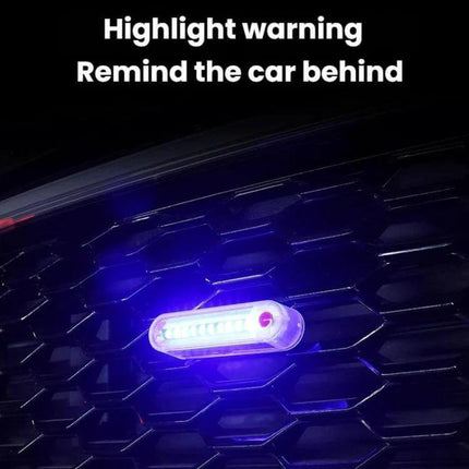 Solar-Powered Car Warning Taillights, Self-Adhesive mounted on car grille showing bright blue LED warning light for improved roadside visibility